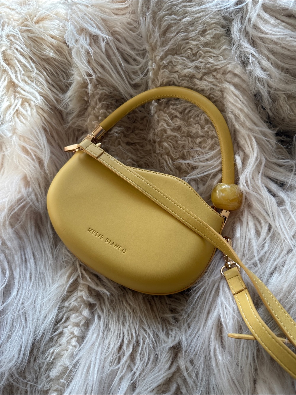 Melie Bianco Yellow Curved Top-Handle Mini Bag with Gold Accents